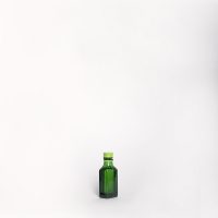 Nick Sambrooks 07/04/2017 - This small green bottle was purchased from a supermarket in central Germany whilst on a cycling trip through Europe. Its contents (some sort of digestive alcohol) was drunk & the bottle commenced a journey in the bottom of a saddlebag to finally end up on a window sill in Freo.